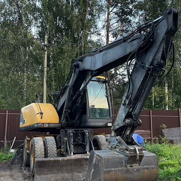 Колёсный экскаватор Volvo EW140, 2000
